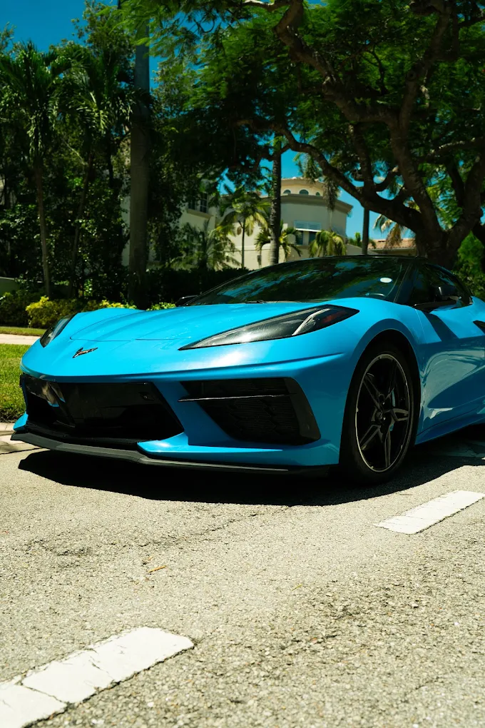 Turquoise Chevrolet Corvette C8, low front angle