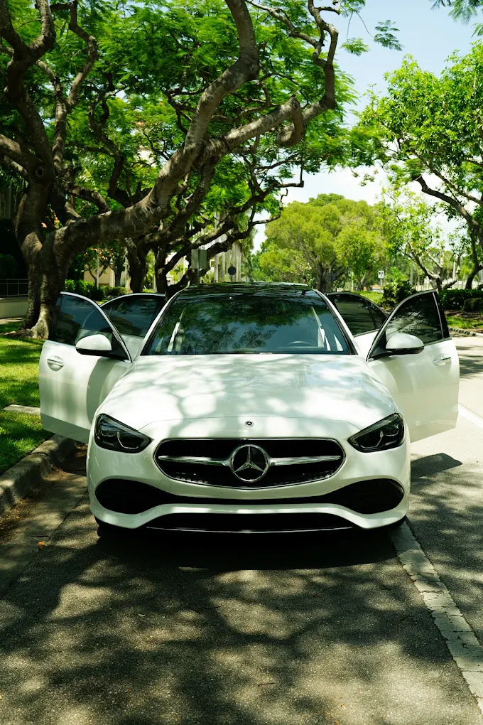 White Mercedes-Benz C300, front with doors open