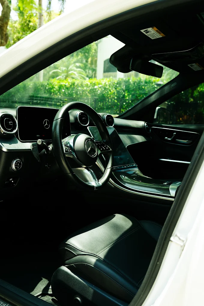 Mercedes-Benz C300 interior viewed through the driver door