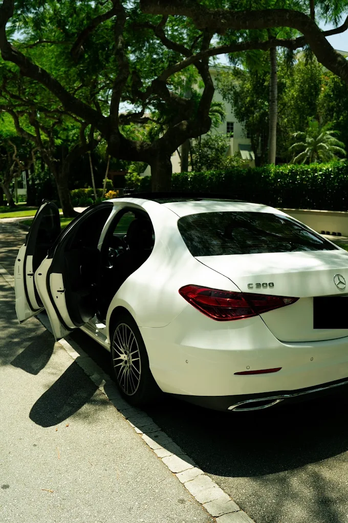 White Mercedes-Benz C300 with its doors open